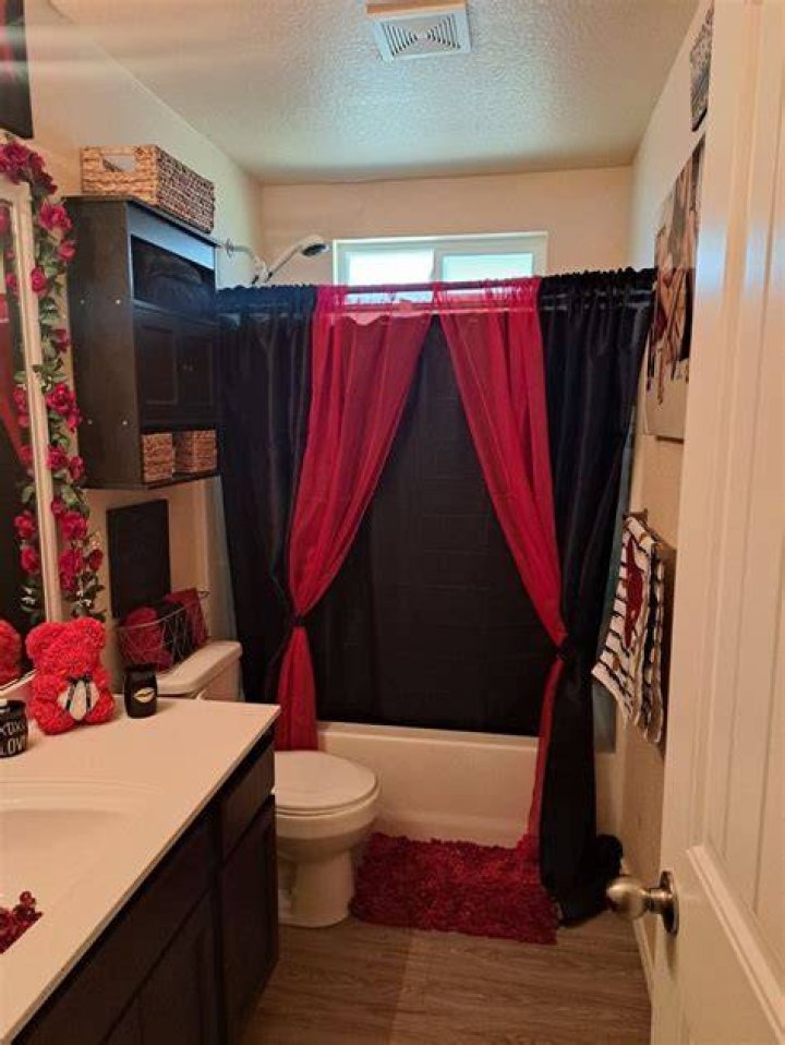 Transform Your Bathroom with Bold Red and Black Decor